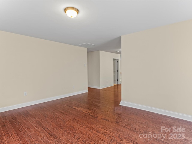 unfurnished room featuring hardwood / wood-style floors