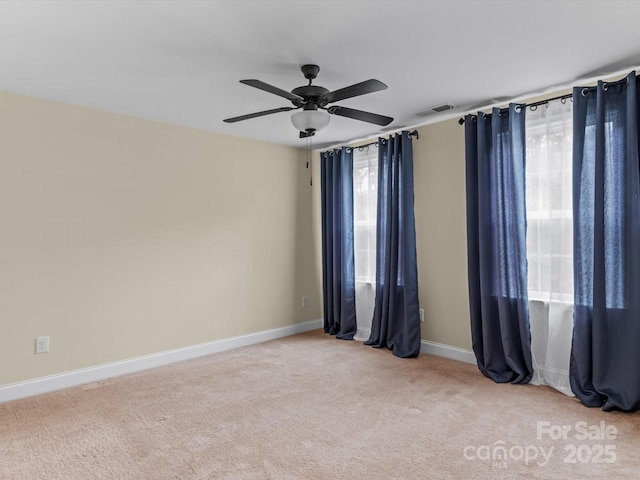 carpeted empty room with ceiling fan