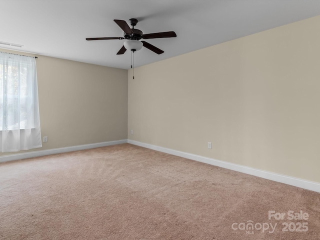 spare room with light carpet and ceiling fan