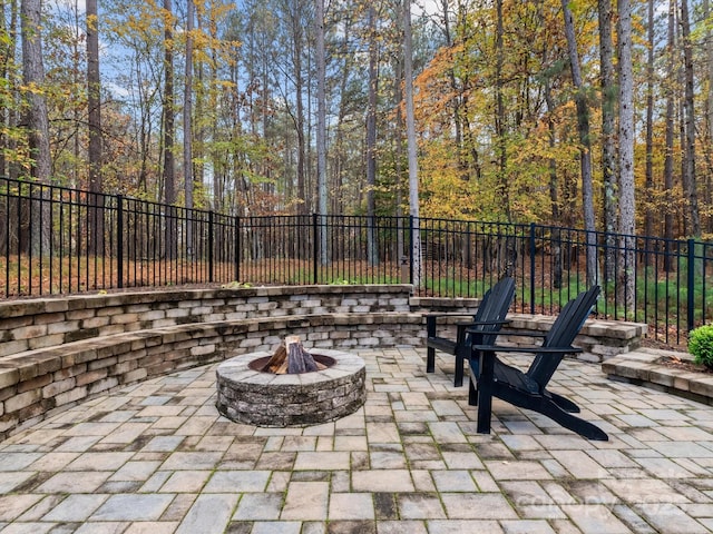 view of patio / terrace with an outdoor fire pit