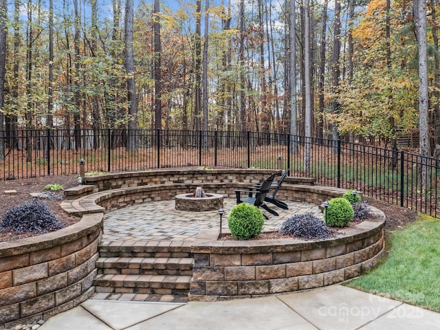 view of patio / terrace featuring a fire pit