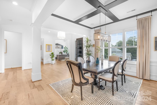 dining area featuring beam ceiling, coffered ceiling, light hardwood / wood-style flooring, a notable chandelier, and decorative columns