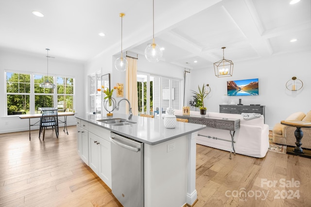 kitchen with a healthy amount of sunlight, sink, an island with sink, and stainless steel dishwasher