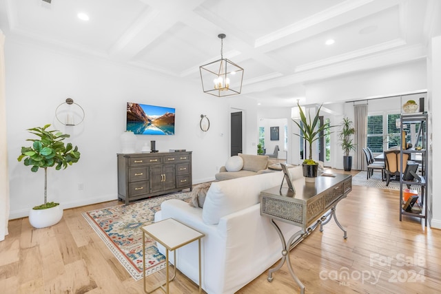 living room featuring beam ceiling, a chandelier, light hardwood / wood-style floors, and coffered ceiling