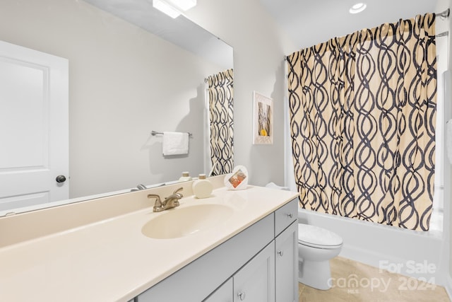 full bathroom with tile patterned flooring, shower / tub combo with curtain, vanity, and toilet