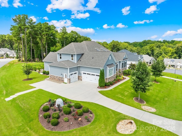 view of front of property with a front yard and a garage