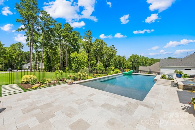 view of swimming pool featuring a patio