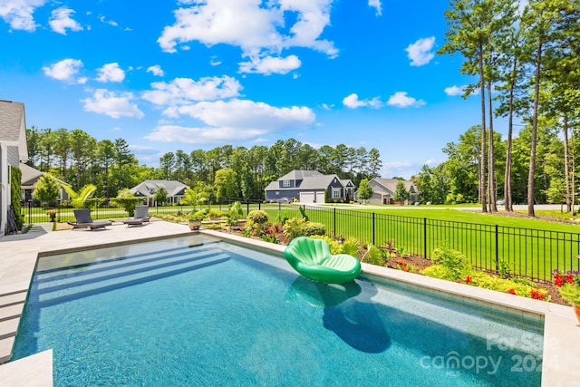 view of swimming pool with a patio