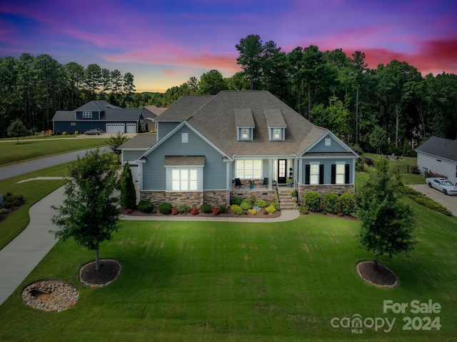 view of front of property with a lawn