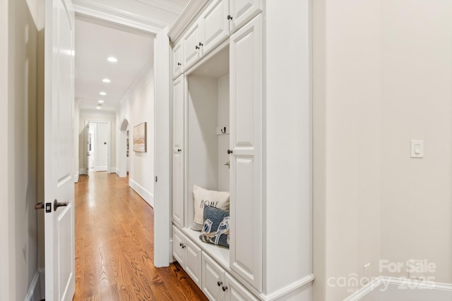 mudroom featuring ornamental molding, recessed lighting, baseboards, and light wood finished floors