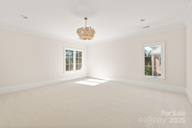 empty room with light colored carpet, crown molding, baseboards, and an inviting chandelier