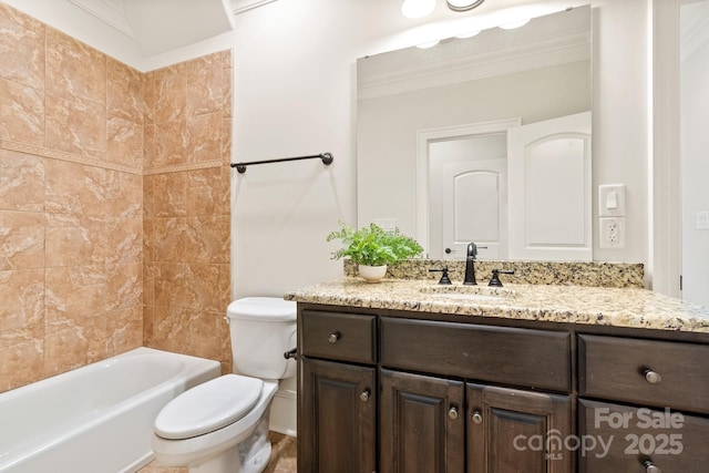 bathroom featuring ornamental molding, vanity, and toilet