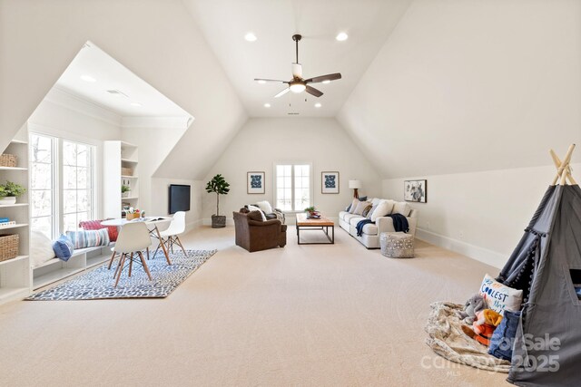 interior space with lofted ceiling, recessed lighting, carpet flooring, and baseboards