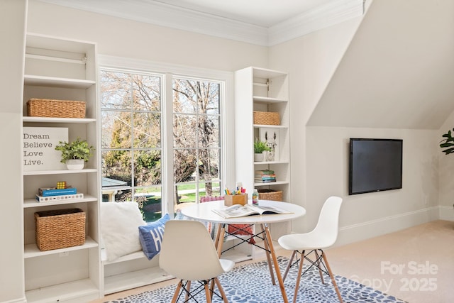 dining space with ornamental molding, a wealth of natural light, and baseboards