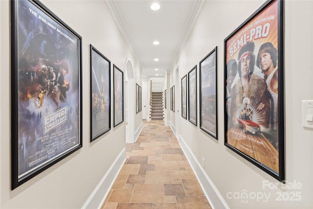 hallway featuring baseboards, stairway, ornamental molding, stone finish flooring, and recessed lighting