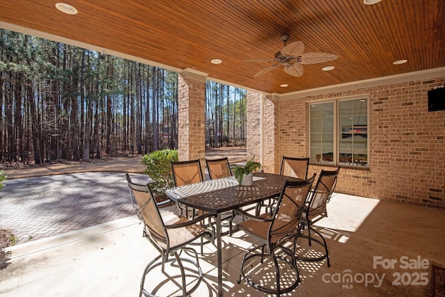 view of patio with a ceiling fan and outdoor dining space