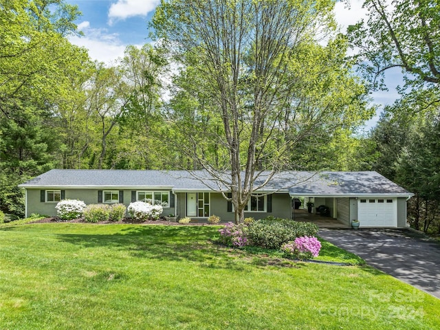 ranch-style home with a front yard and a carport