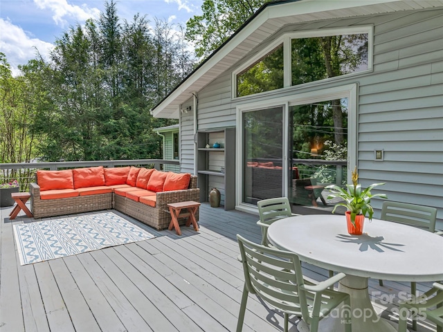 wooden terrace featuring outdoor lounge area