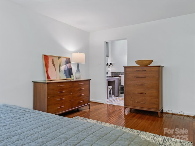 bedroom with hardwood / wood-style floors