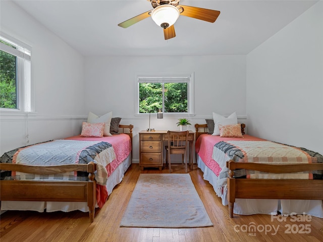 bedroom featuring ceiling fan and light hardwood / wood-style flooring