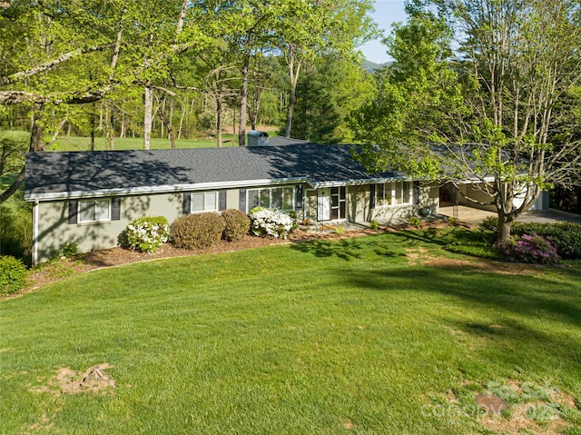 ranch-style house with a front yard