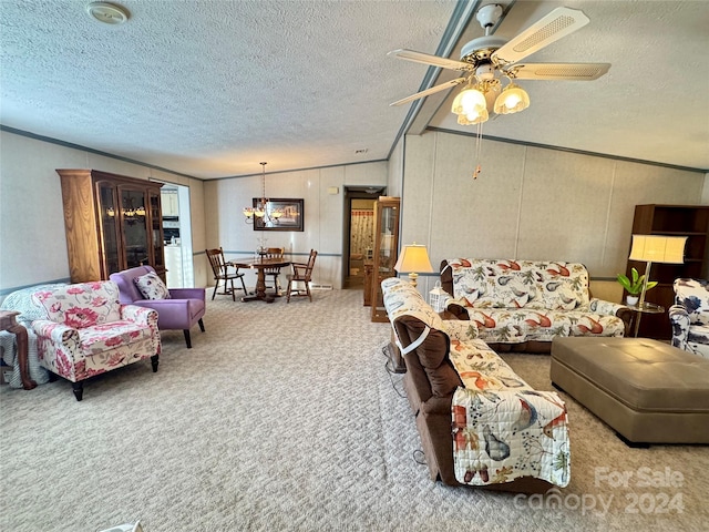 living room with lofted ceiling, a textured ceiling, carpet, ceiling fan with notable chandelier, and ornamental molding