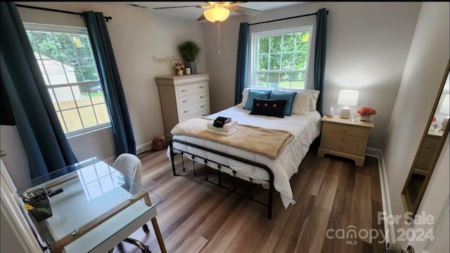 bedroom with ceiling fan and wood-type flooring