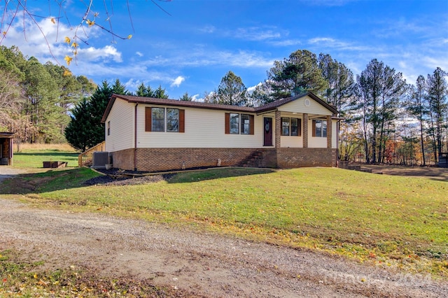 single story home featuring a front lawn and central AC