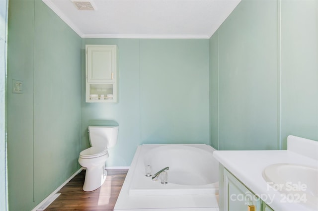 bathroom featuring vanity, crown molding, wood-type flooring, and a tub