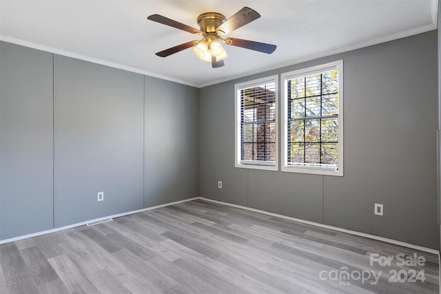 unfurnished room featuring ceiling fan, crown molding, light hardwood / wood-style floors, and a textured ceiling