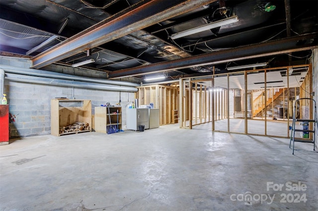 basement with washer and clothes dryer