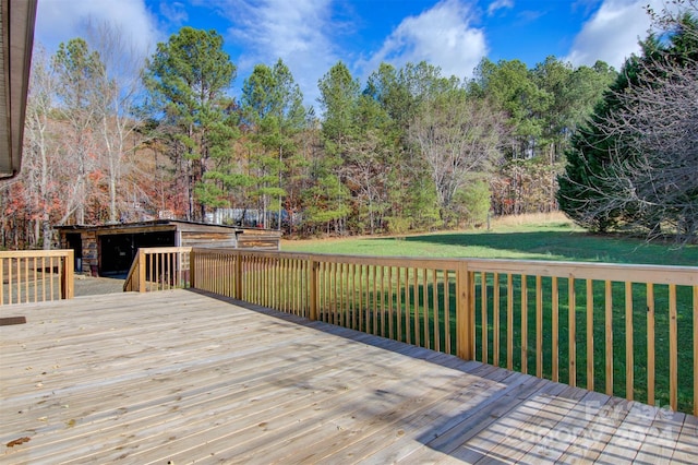 wooden deck with a lawn