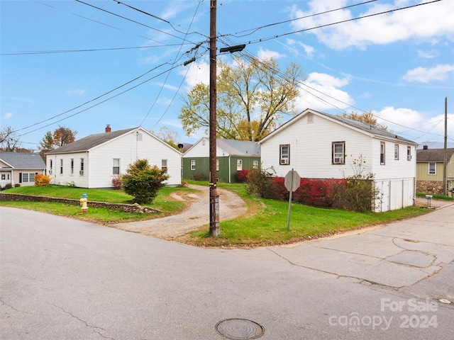 view of side of property with a yard