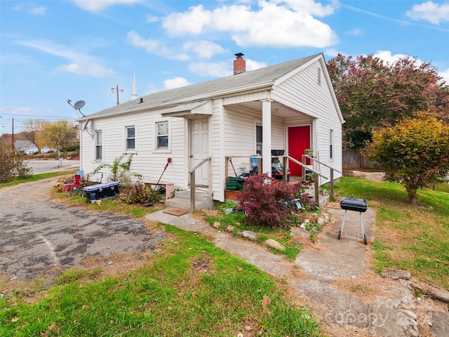 1199 Newfound St, Canton, NC 28716 - view of front facade with a chimney and a porch