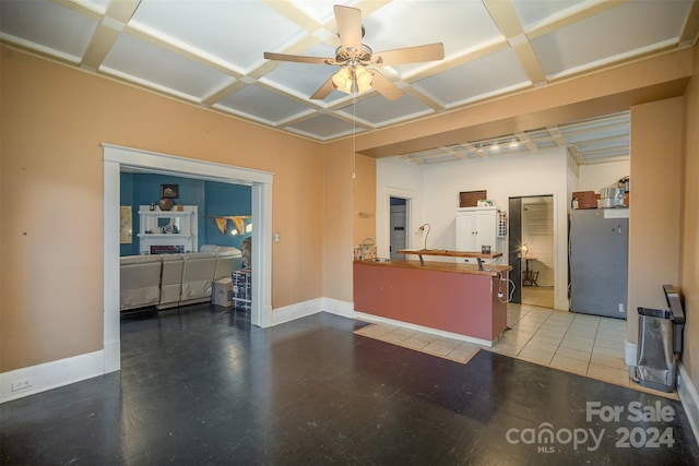 kitchen featuring stainless steel fridge, tile patterned flooring, ceiling fan, and coffered ceiling