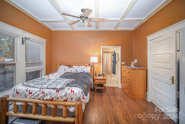 bedroom with wood-type flooring, ceiling fan, and coffered ceiling