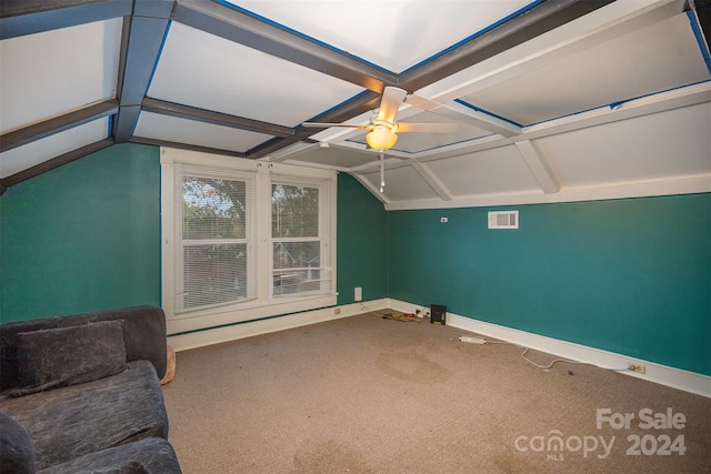 additional living space featuring ceiling fan, lofted ceiling with beams, and carpet floors