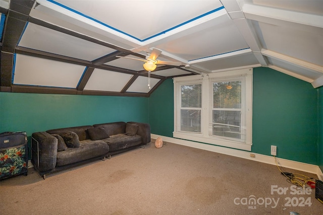 living room featuring vaulted ceiling with beams, ceiling fan, and carpet floors