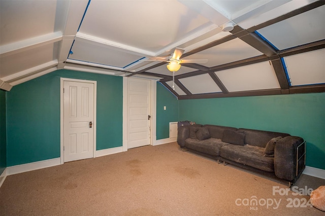 living room featuring ceiling fan, carpet floors, and lofted ceiling with beams