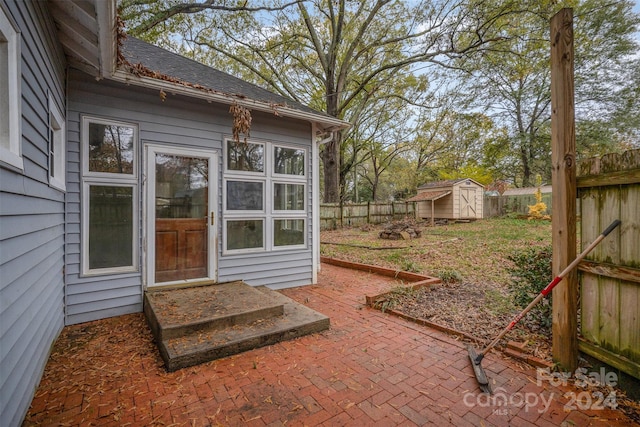 view of patio with a storage shed