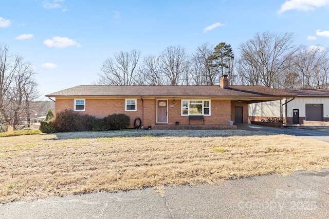 single story home featuring a carport