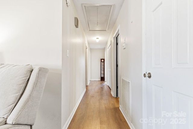 hall with light wood-type flooring