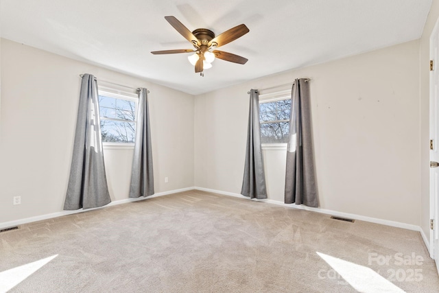 carpeted empty room with ceiling fan