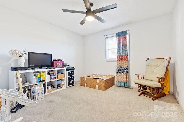 interior space featuring carpet floors and ceiling fan