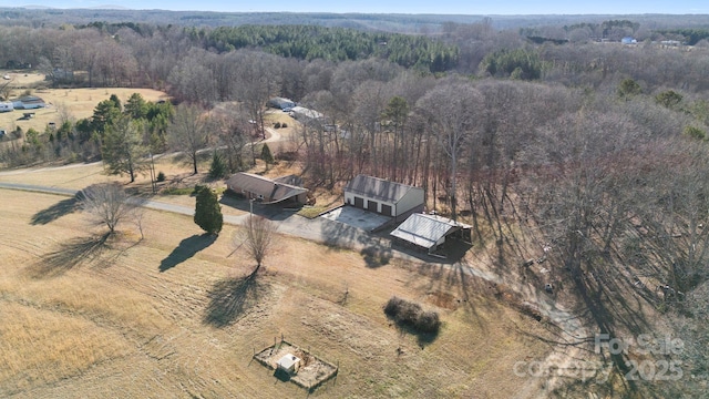 birds eye view of property featuring a rural view