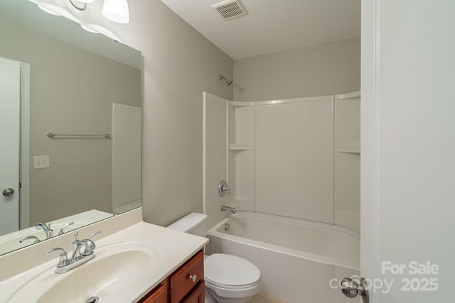 full bathroom featuring toilet, washtub / shower combination, visible vents, and vanity