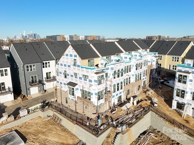 birds eye view of property with a view of city