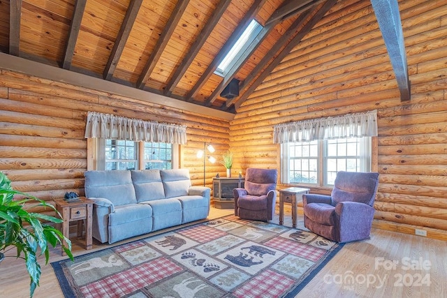 living room featuring a skylight, log walls, beam ceiling, hardwood / wood-style flooring, and high vaulted ceiling