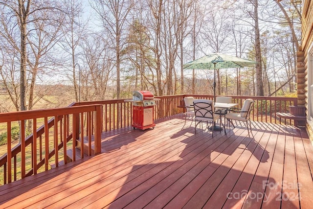 wooden terrace featuring grilling area