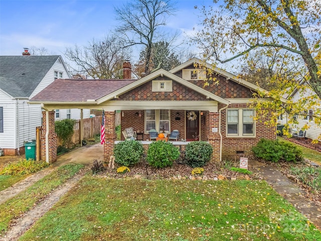 view of front of home featuring a porch and a front yard